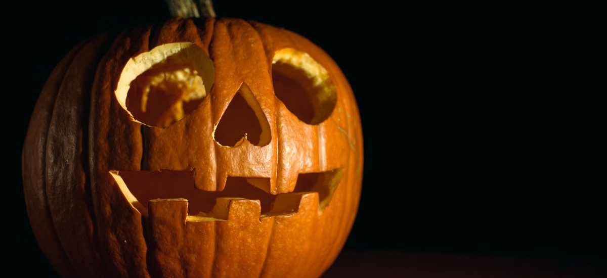 Close-up of a glowing carved pumpkin, perfect for Halloween themes.