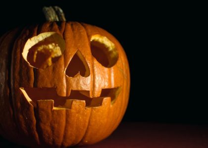 Close-up of a glowing carved pumpkin, perfect for Halloween themes.